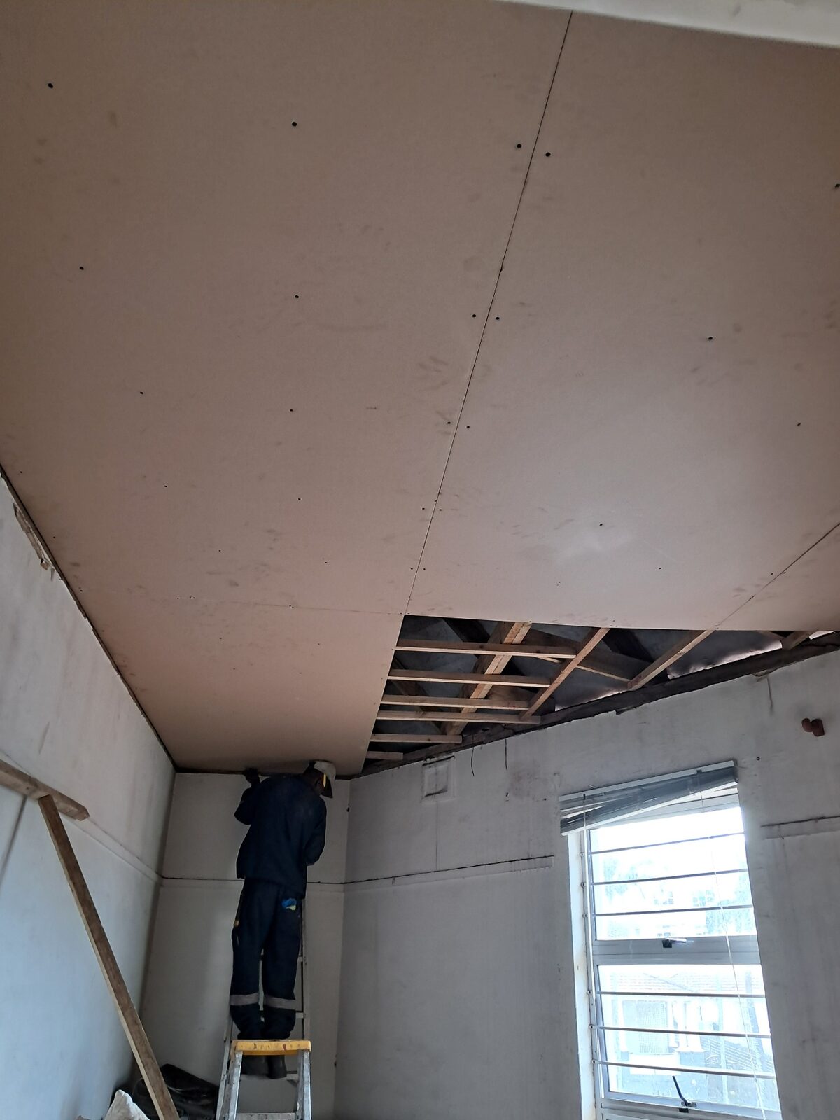 Damaged interior ceiling from roof leak