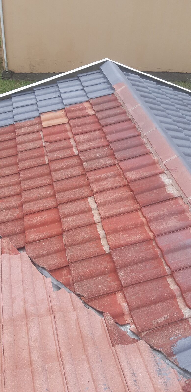 Crew working at height on tile roof