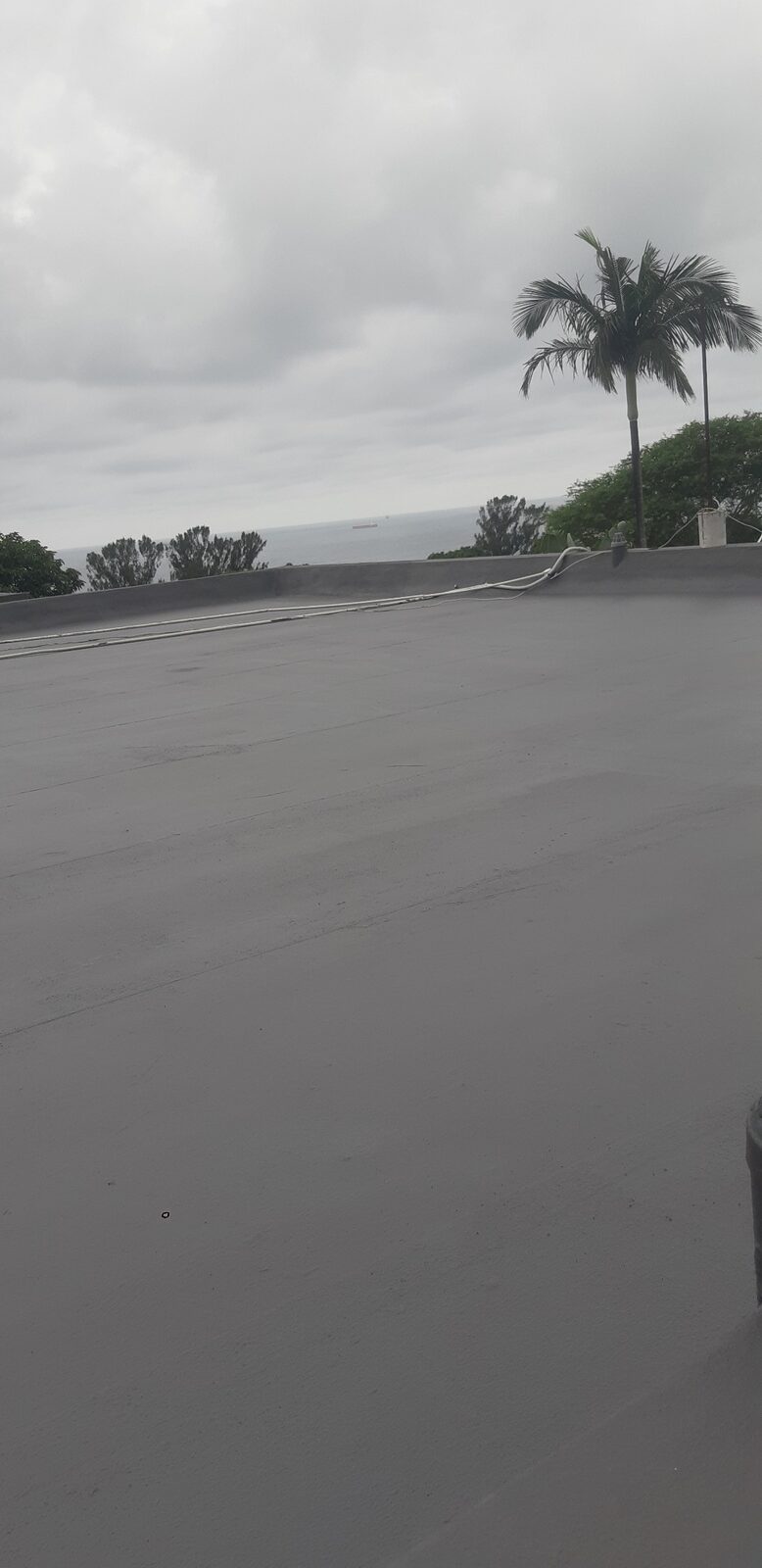 Crew working on grey home re-roof